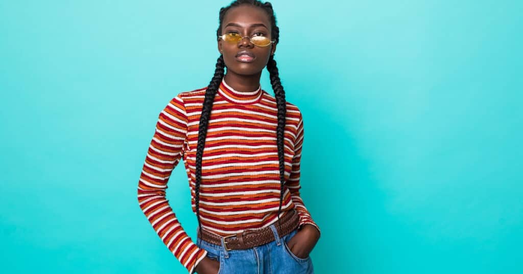 Black Woman with braids and sunglasses